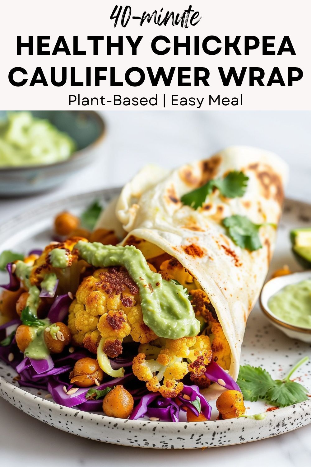 pinterest-ready image of a close-up of a gluten-free chickpea cauliflower wrap with lime showing colorful roasted filling and avocado lime sauce