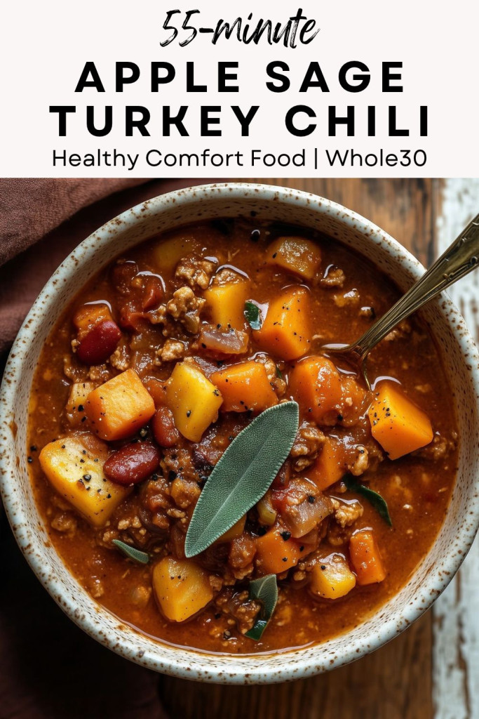 pinterest-ready image of apple sage turkey chili in a cream stoneware bowl with sweet potatoes, carrots and fresh sage